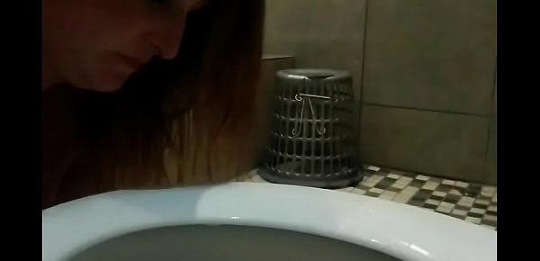  Busty big bbw licking the toilet seat clean after pissing in and on it
